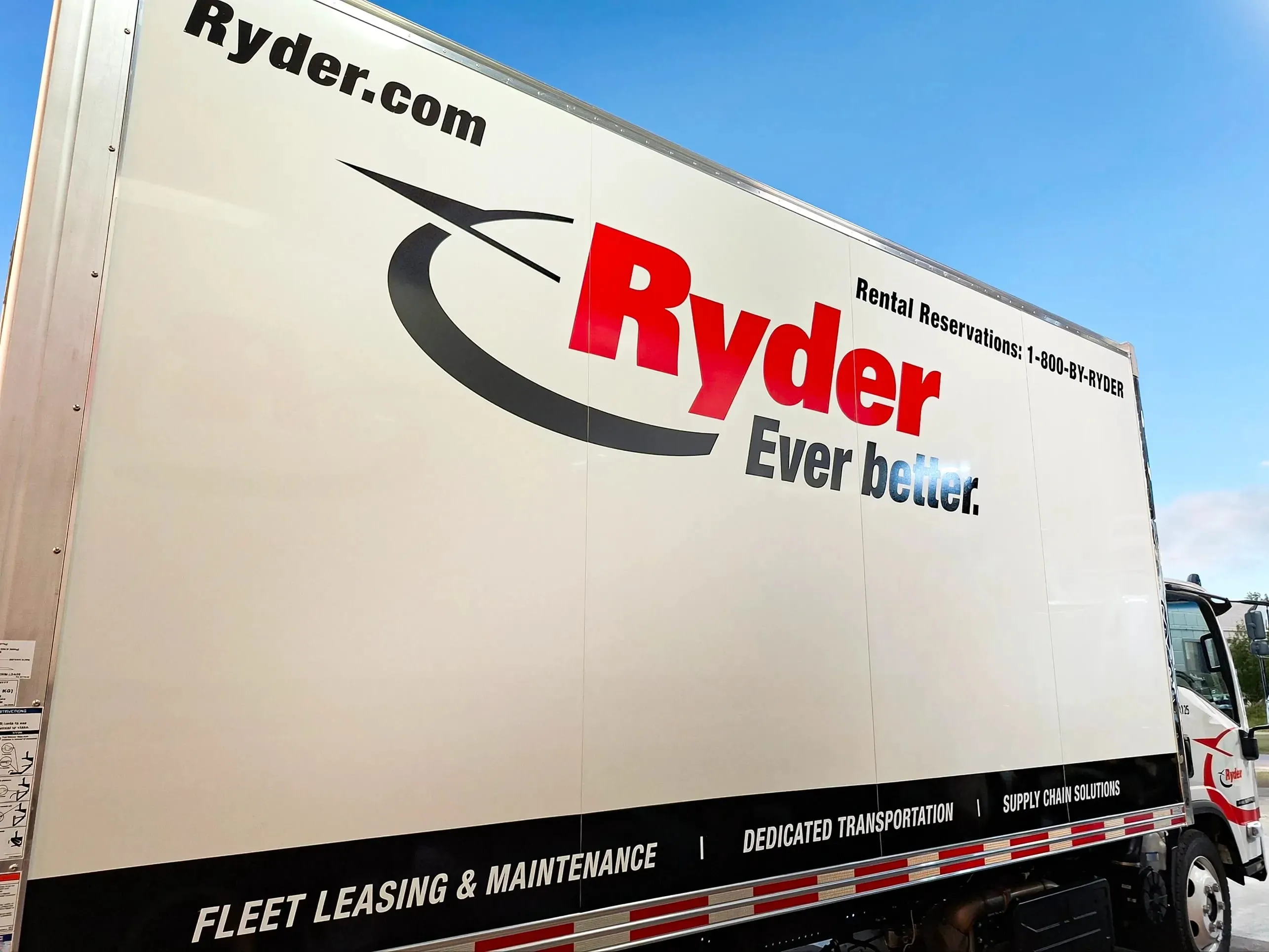 Ryder box truck with red logo graphics along the cargo body